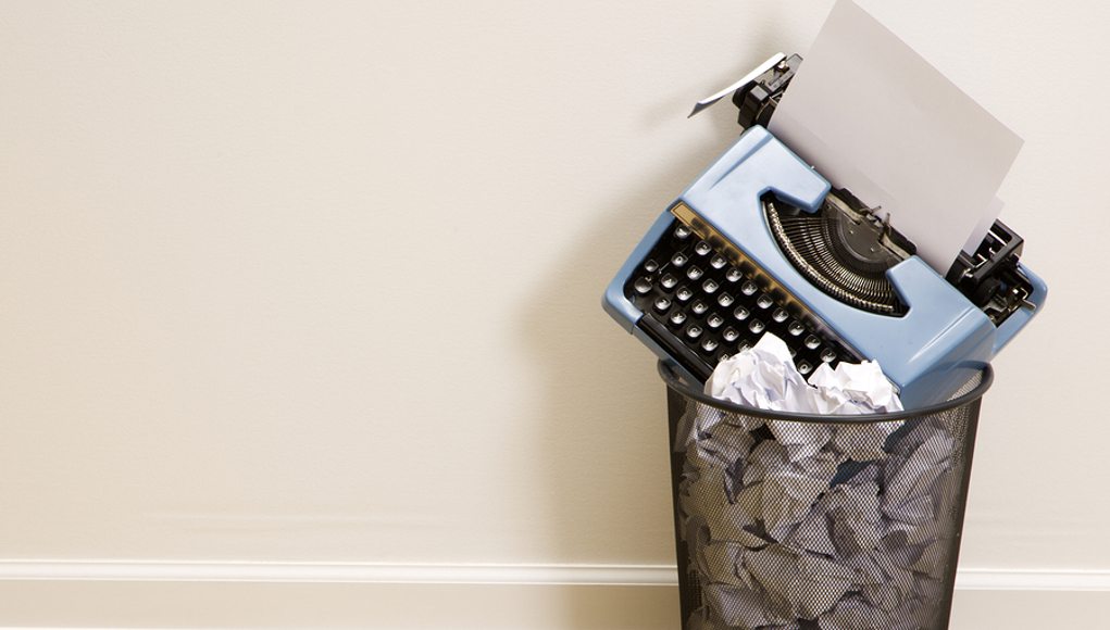 Typewriter-in-garbage-can-feature-image
